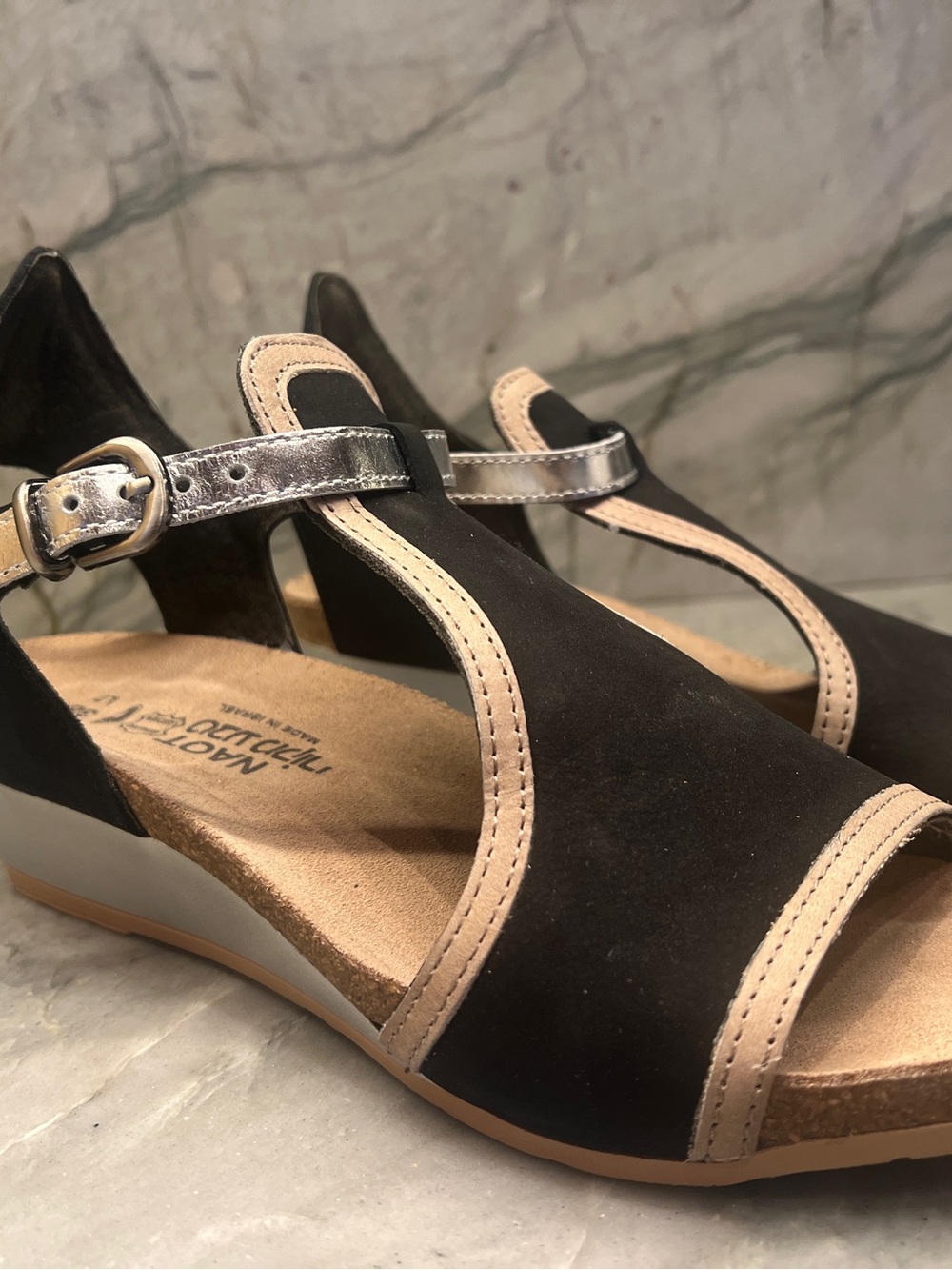 Naot Black Sandals with Beige Trim and Metallic Buckle